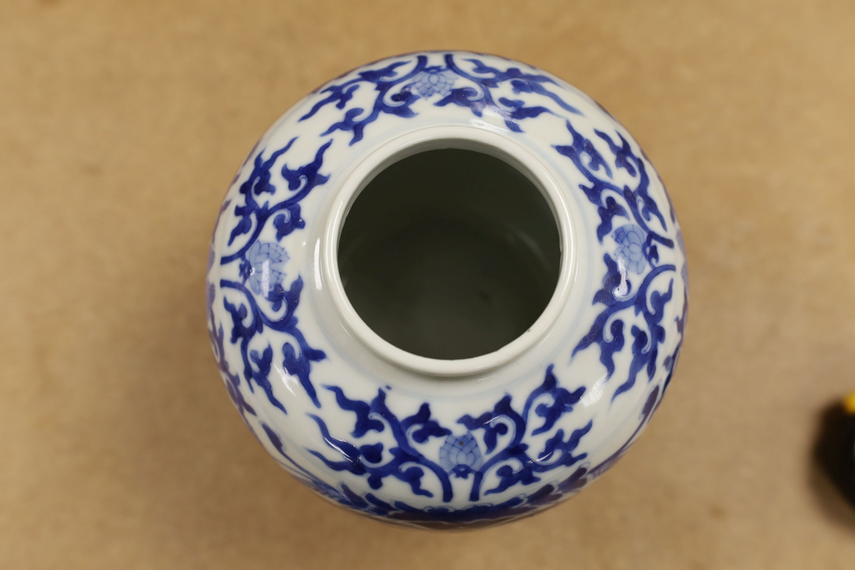 A pair of Chinese blue and white ginger jars and covers, 22cm, On stands